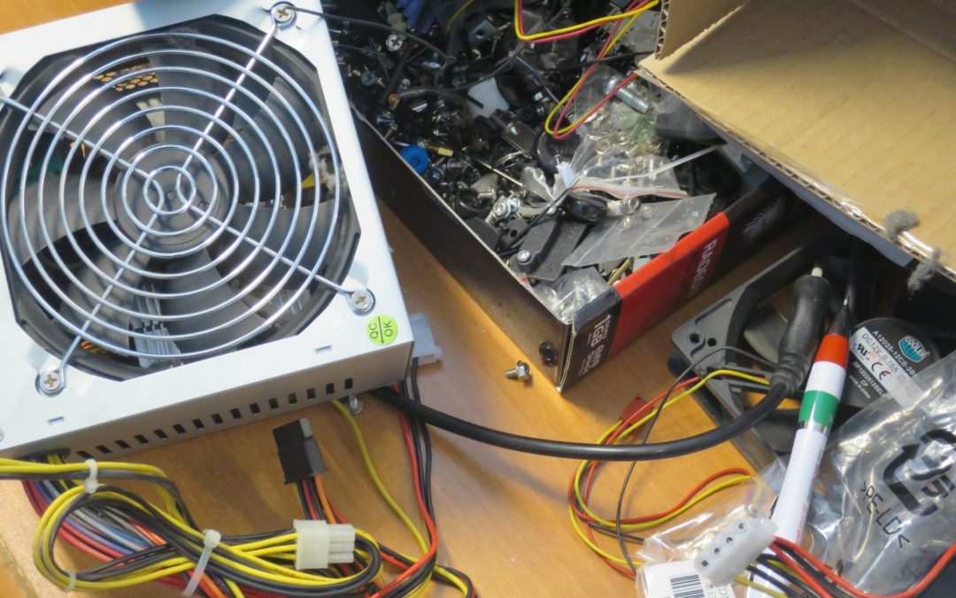 Technician fixing PC hardware components, focused on maintenance and repair of a computer system for improved performance.
